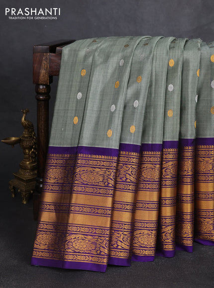 Pure gadwal silk saree greyish green and violet with silver & gold zari woven buttas and long zari woven border