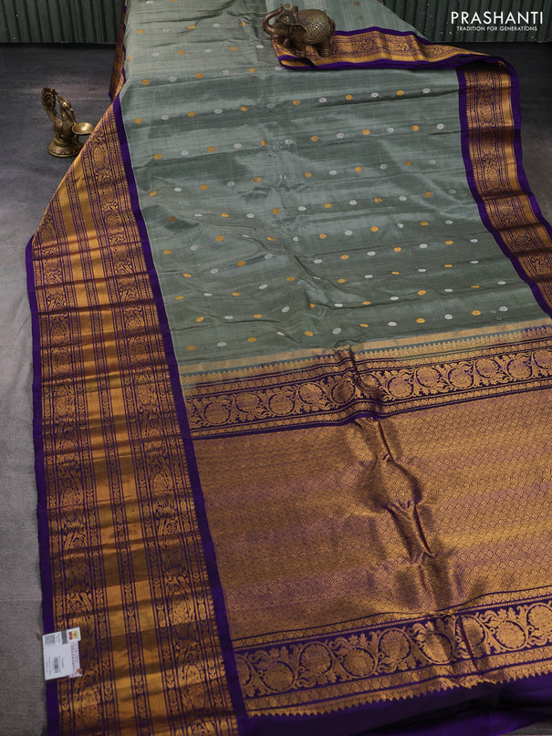 Pure gadwal silk saree greyish green and violet with silver & gold zari woven buttas and long zari woven border