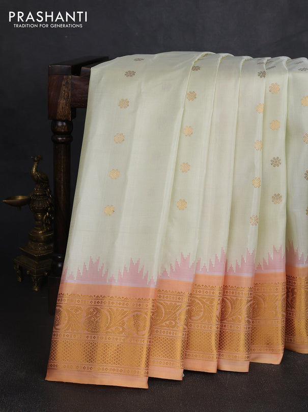 Pure gadwal silk saree cream and peach shade with allover zari woven buttas and temple design zari woven border