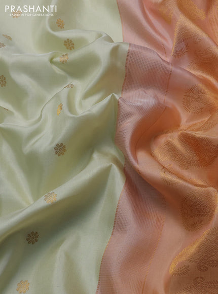 Pure gadwal silk saree cream and peach shade with allover zari woven buttas and temple design zari woven border