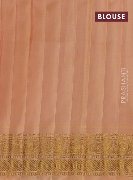Pure gadwal silk saree cream and peach shade with allover zari woven buttas and temple design zari woven border