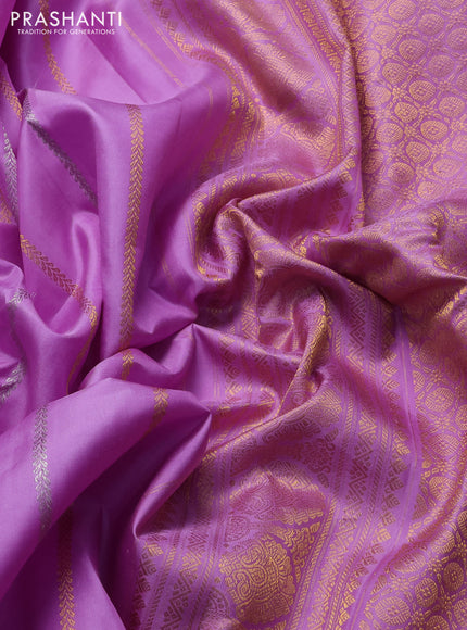 Pure gadwal silk saree lavender with allover zari weaves and peacock zari woven butta border