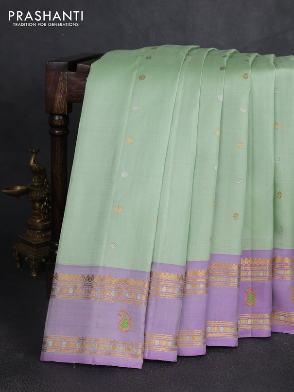Pure gadwal silk saree pista green and mild lavender with allover silver & gold zari woven buttas and rettapet zari woven border