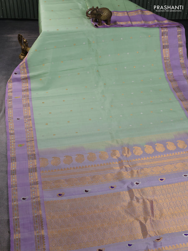 Pure gadwal silk saree pista green and mild lavender with allover silver & gold zari woven buttas and rettapet zari woven border