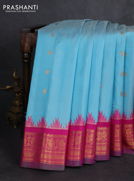 Pure gadwal silk saree light blue and magenta pink with zari woven buttas and temple design zari woven border