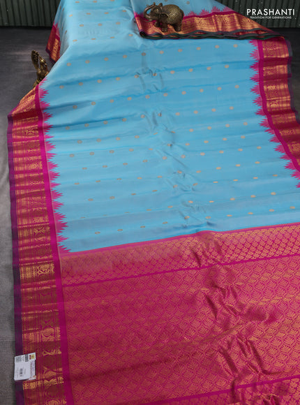 Pure gadwal silk saree light blue and magenta pink with zari woven buttas and temple design zari woven border