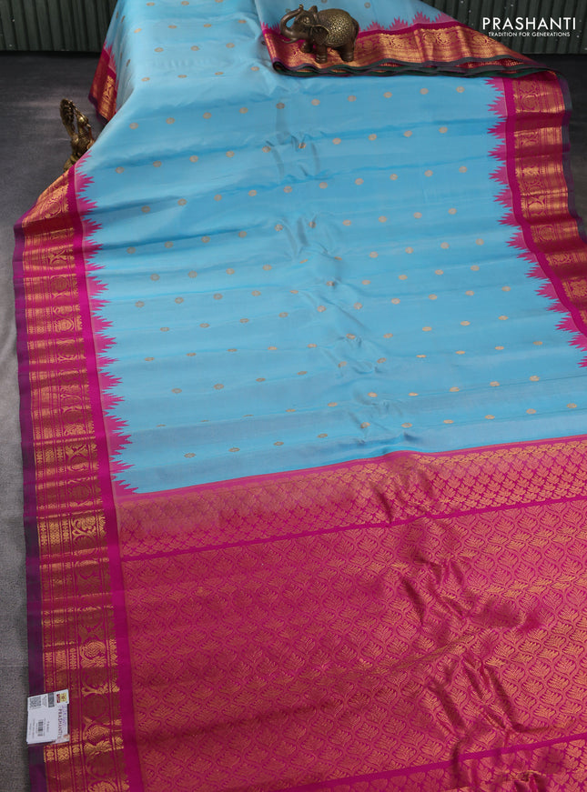 Pure gadwal silk saree light blue and magenta pink with zari woven buttas and temple design zari woven border