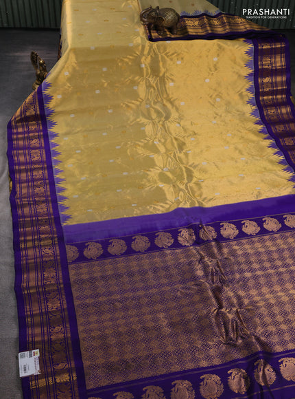 Pure gadwal tissue silk saree gold and violet with allover silver & gold zari woven buttas and temple design zari woven border