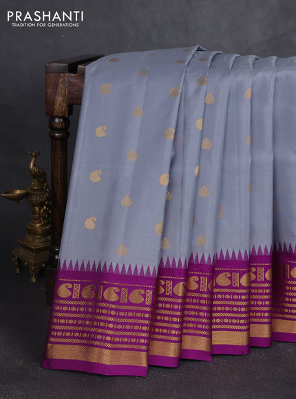 Pure gadwal silk saree grey and purple with allover zari woven buttas and temple design zari woven border