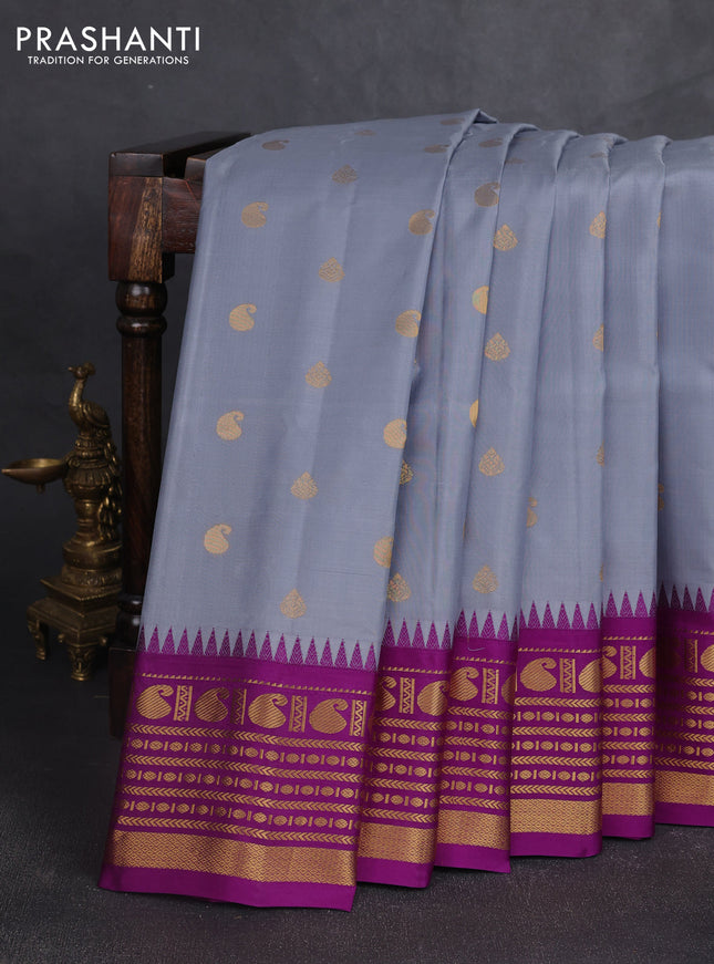 Pure gadwal silk saree grey and purple with allover zari woven buttas and temple design zari woven border