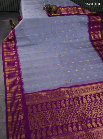 Pure gadwal silk saree grey and purple with allover zari woven buttas and temple design zari woven border