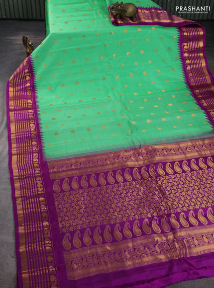 Pure gadwal silk saree teal green and purple with zari woven buttas and temple design zari woven border
