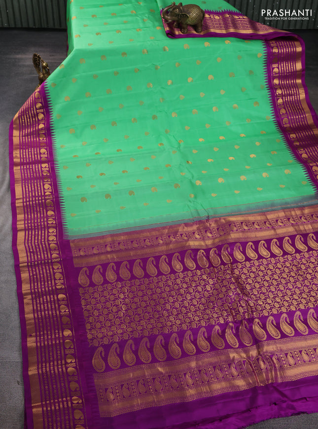 Pure gadwal silk saree teal green and purple with zari woven buttas and temple design zari woven border