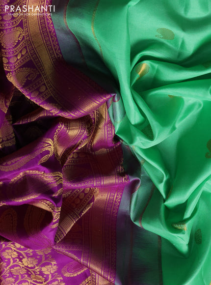 Pure gadwal silk saree teal green and purple with zari woven buttas and temple design zari woven border