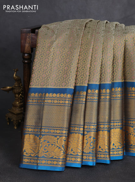 Pure gadwal silk saree grey shade and cs blue with allover zari woven brocade weaves and long zari woven border