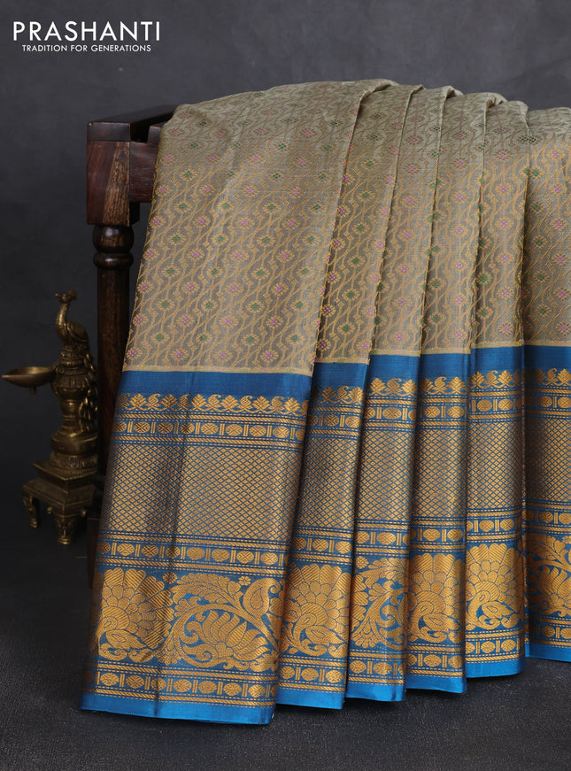 Pure gadwal silk saree grey shade and cs blue with allover zari woven brocade weaves and long zari woven border