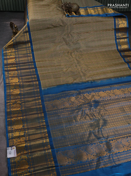 Pure gadwal silk saree grey shade and cs blue with allover zari woven brocade weaves and long zari woven border