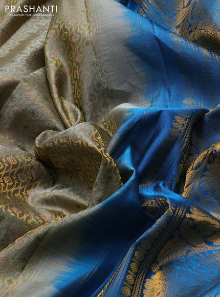 Pure gadwal silk saree grey shade and cs blue with allover zari woven brocade weaves and long zari woven border