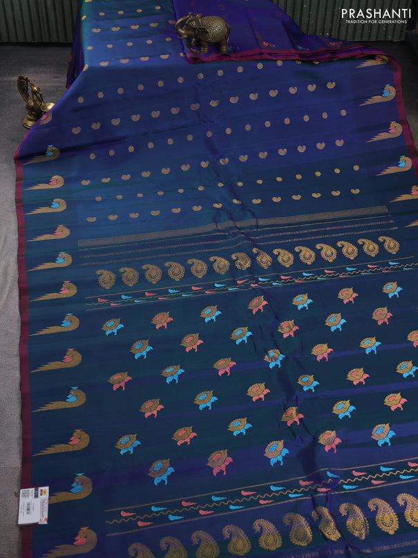 Pure gadwal silk saree dual shade of bluish green and pink with allover zari woven buttas and peacock zari woven butta border
