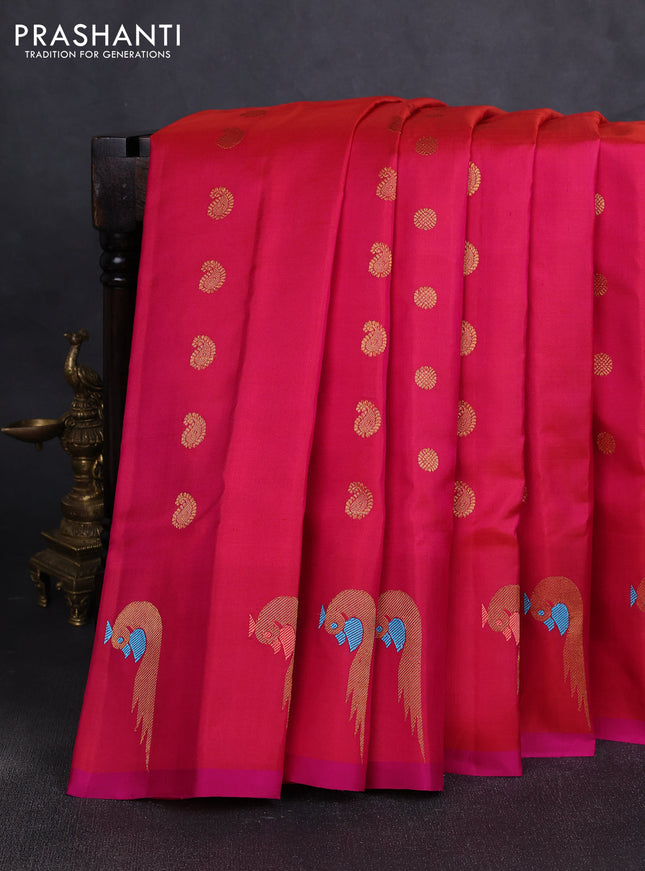 Pure gadwal silk saree dual shade of pinkish oarnge and pink with allover zari woven buttas and peacock zari woven butta border