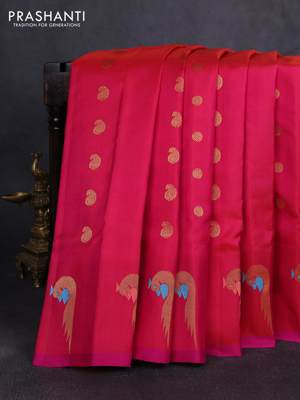 Pure gadwal silk saree dual shade of pinkish oarnge and pink with allover zari woven buttas and peacock zari woven butta border