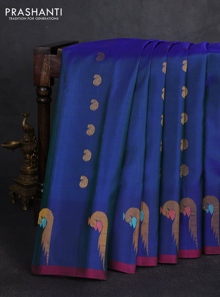 Pure gadwal silk saree dual shade of blue with allover zari woven buttas and peacock zari woven butta border