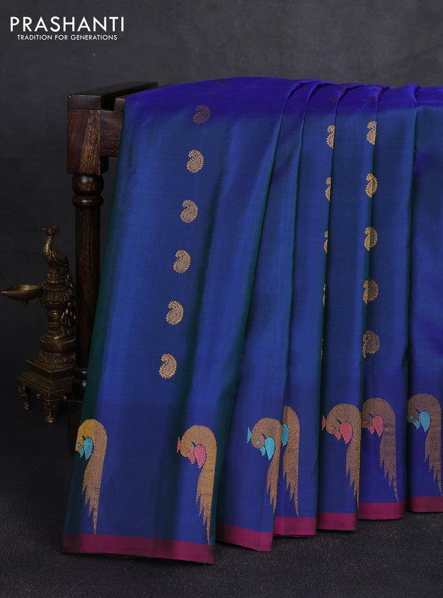 Pure gadwal silk saree dual shade of blue with allover zari woven buttas and peacock zari woven butta border