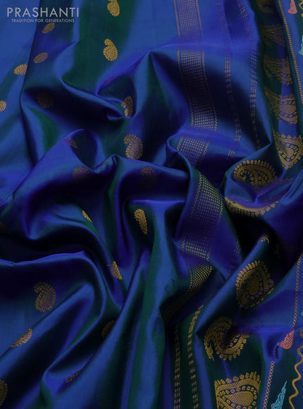 Pure gadwal silk saree dual shade of blue with allover zari woven buttas and peacock zari woven butta border