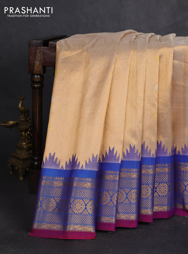 Pure gadwal tissue silk saree gold and cs blue with silver & gold zari woven buttas and temple design zari woven border