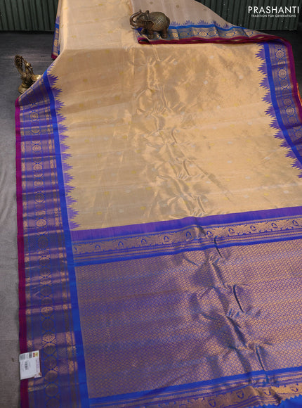 Pure gadwal tissue silk saree gold and cs blue with silver & gold zari woven buttas and temple design zari woven border
