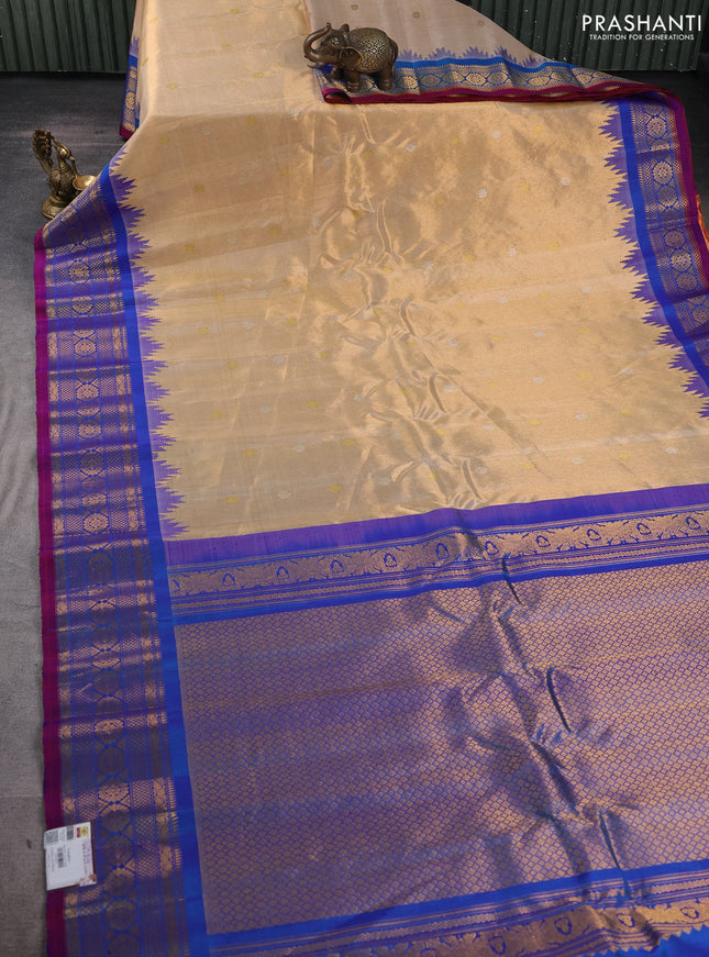 Pure gadwal tissue silk saree gold and cs blue with silver & gold zari woven buttas and temple design zari woven border