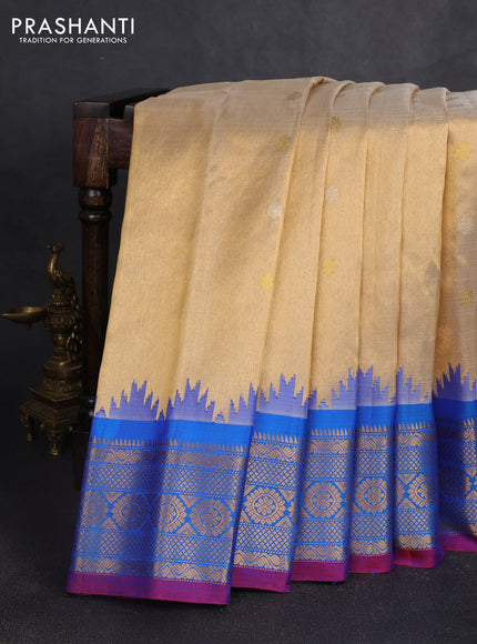 Pure gadwal tissue silk saree gold and cs blue with allover silver & gold zari woven buttas and temple design zari woven border