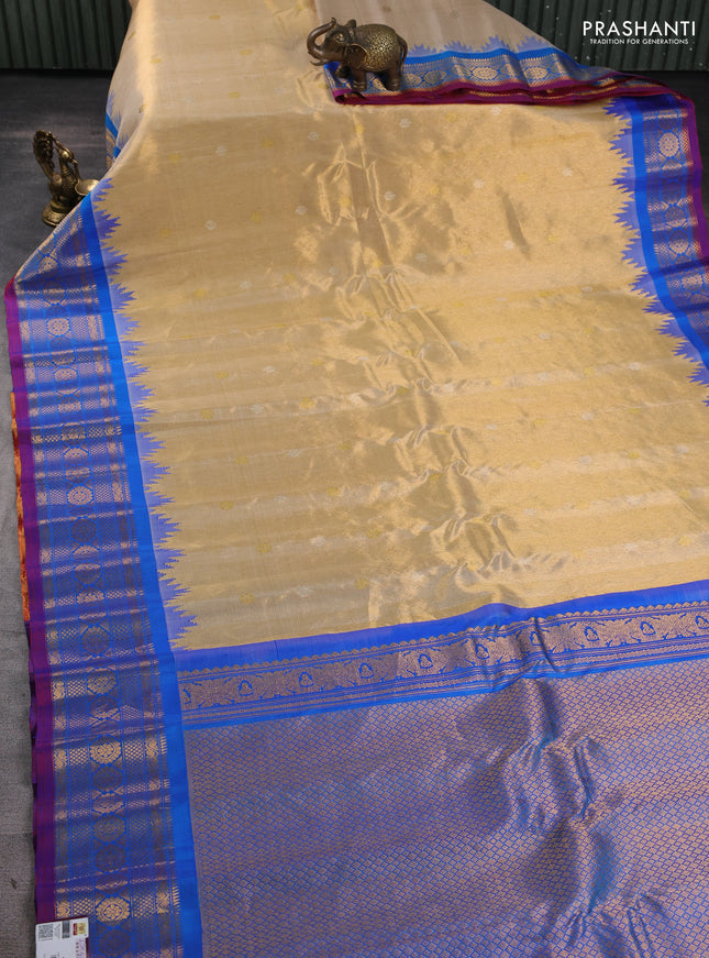 Pure gadwal tissue silk saree gold and cs blue with allover silver & gold zari woven buttas and temple design zari woven border