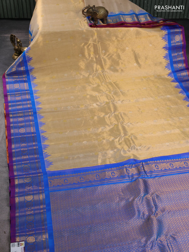 Pure gadwal tissue silk saree gold and cs blue with allover silver & gold zari woven buttas and temple design zari woven border