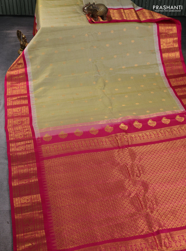 Pure gadwal silk saree elachi green and tomato pink with allover zari checks & buttas and temple design zari woven border