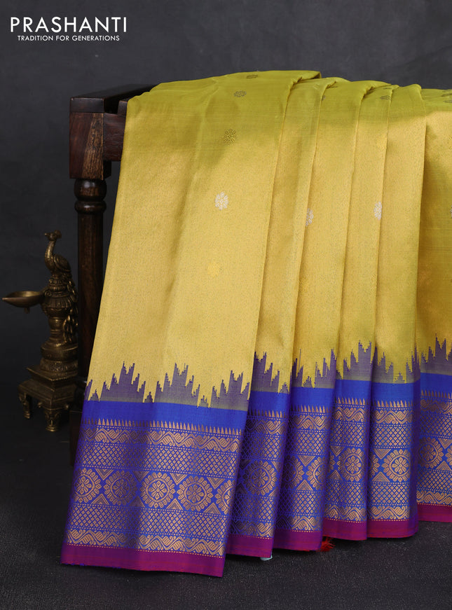 Pure gadwal silk saree lime yellow and blue with allover silver & gold zari woven buttas and temple design zari woven border