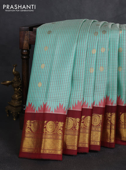 Pure gadwal silk saree teal green shade and maroon with allover checked pattern & zari buttas and zari woven border
