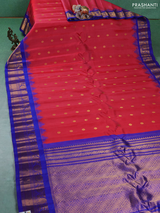 Pure gadwal silk saree tomato pink and blue with allover zari woven buttas and temple design zari woven border