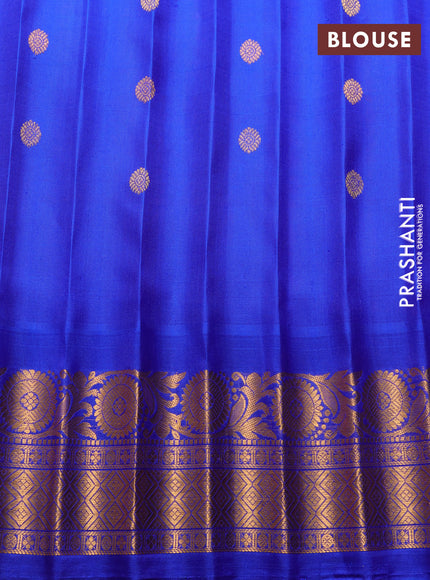 Pure gadwal silk saree tomato pink and blue with allover zari woven buttas and temple design zari woven border