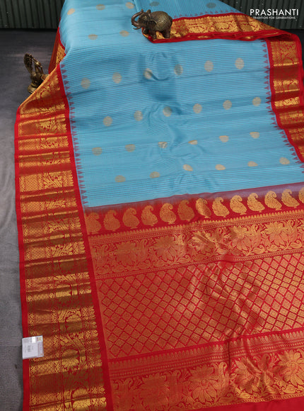 Pure gadwal silk saree cs blue and red with allover thread checks & zari woven buttas and temple design zari woven border