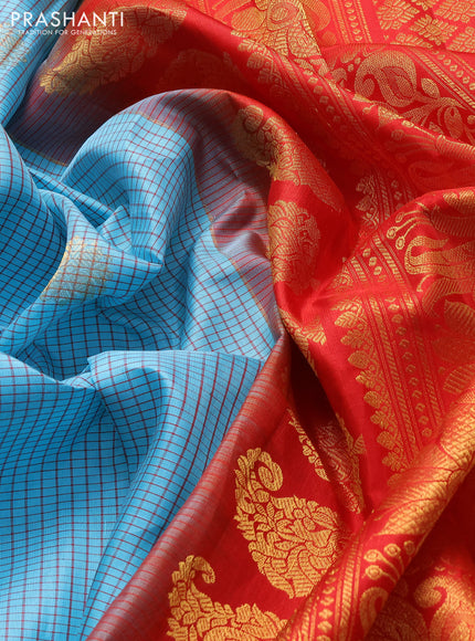 Pure gadwal silk saree cs blue and red with allover thread checks & zari woven buttas and temple design zari woven border