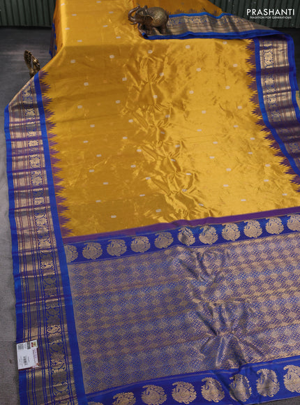 Pure gadwal silk saree mustard yellow and cs blue with allover silver & gold zari woven buttas and temple design zari woven border