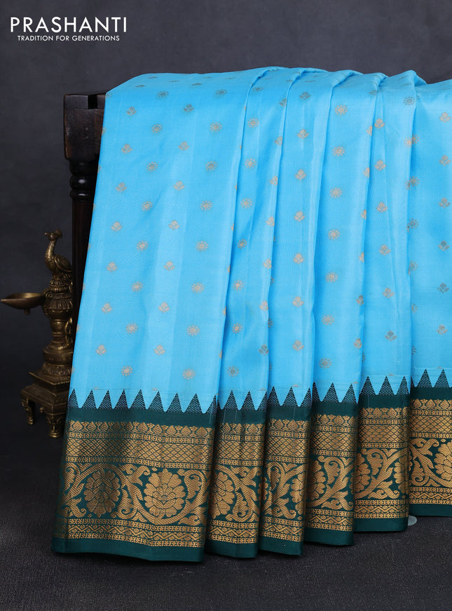 Pure gadwal silk saree light blue and green with allover zari woven buttas and temple design zari woven border