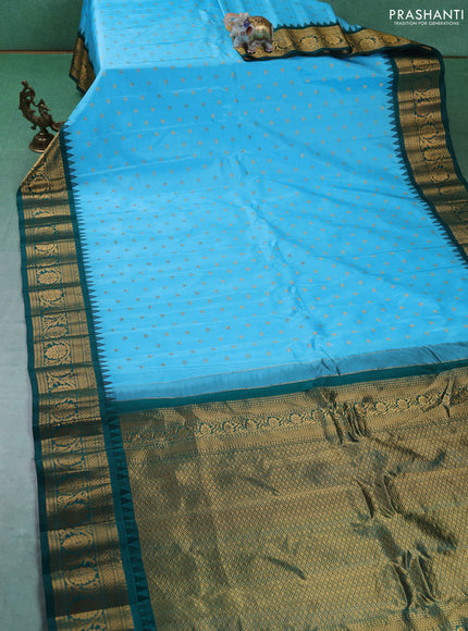 Pure gadwal silk saree light blue and green with allover zari woven buttas and temple design zari woven border