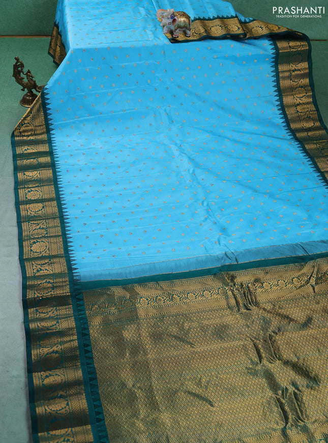 Pure gadwal silk saree light blue and green with allover zari woven buttas and temple design zari woven border