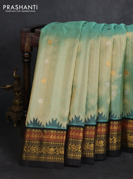 Pure gadwal tissue silk saree pastel green and black with silver & gold zari woven buttas and temple design zari woven border