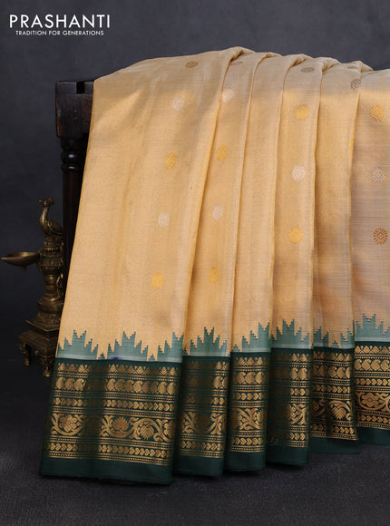 Pure gadwal tissue silk saree gold and bottle green with silver & gold zari woven buttas and temple design zari woven border