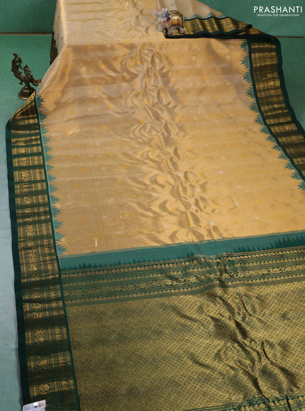 Pure gadwal tissue silk saree gold and bottle green with silver & gold zari woven buttas and temple design zari woven border