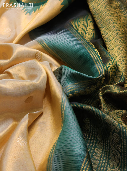 Pure gadwal tissue silk saree gold and bottle green with silver & gold zari woven buttas and temple design zari woven border