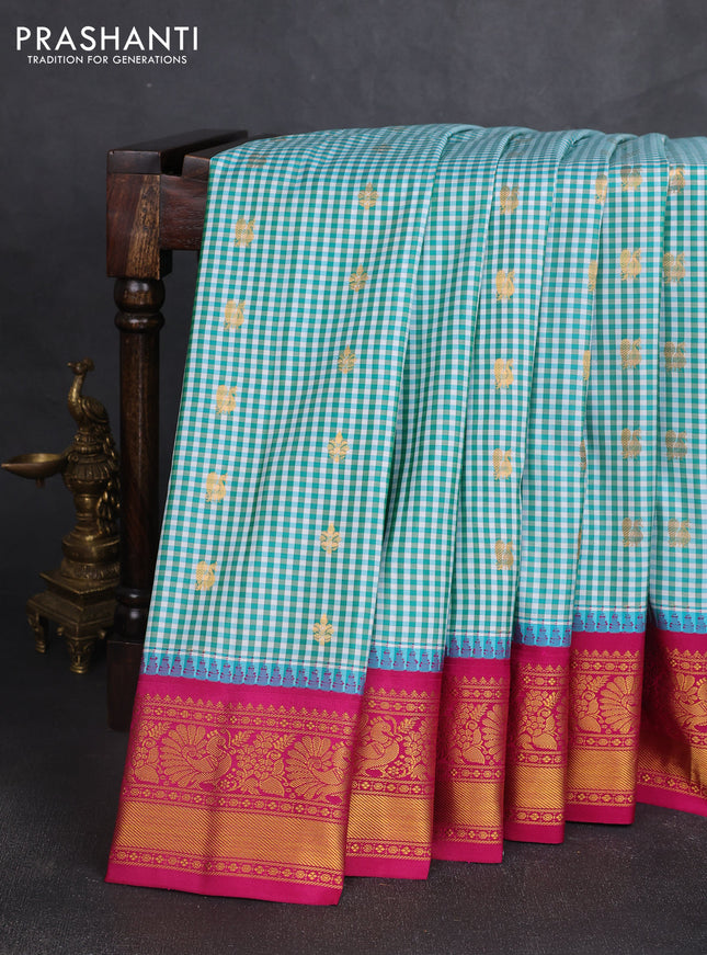 Pure gadwal silk saree off white teal blue and magenta pink with allover checked pattern & zari woven buttas and temple design annam zari woven border